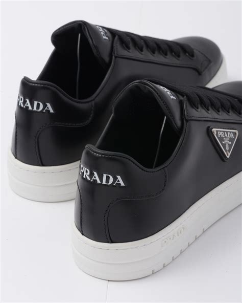 prada sneakers black and white.